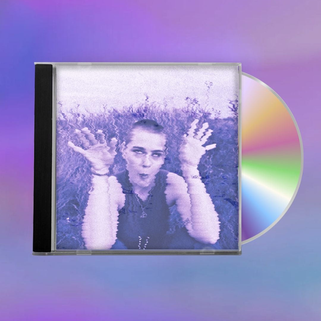 CD with cover showing a person holding up their hands on the cover against a blurred purple background