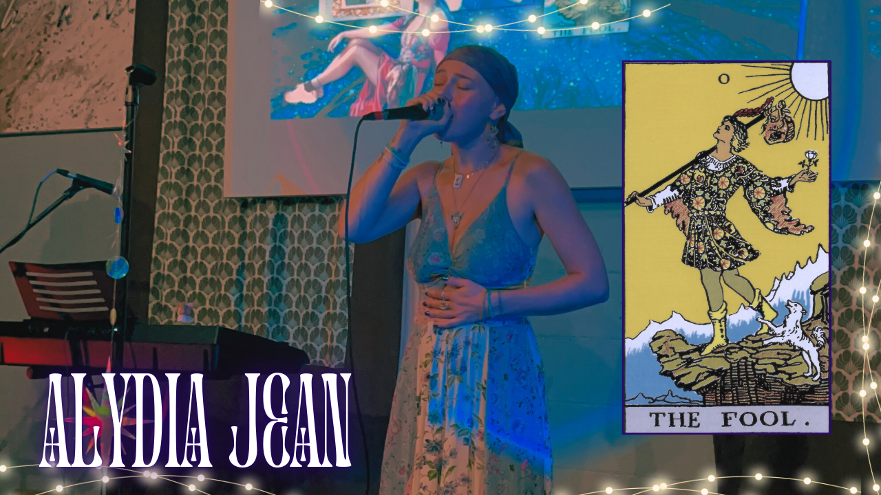 Load video: embedded youtube video of alydia jean singing her song, the fool. Cover image shows Alydia Jean mid-song, The Fool tarot card, and text reading Alydia Jean
